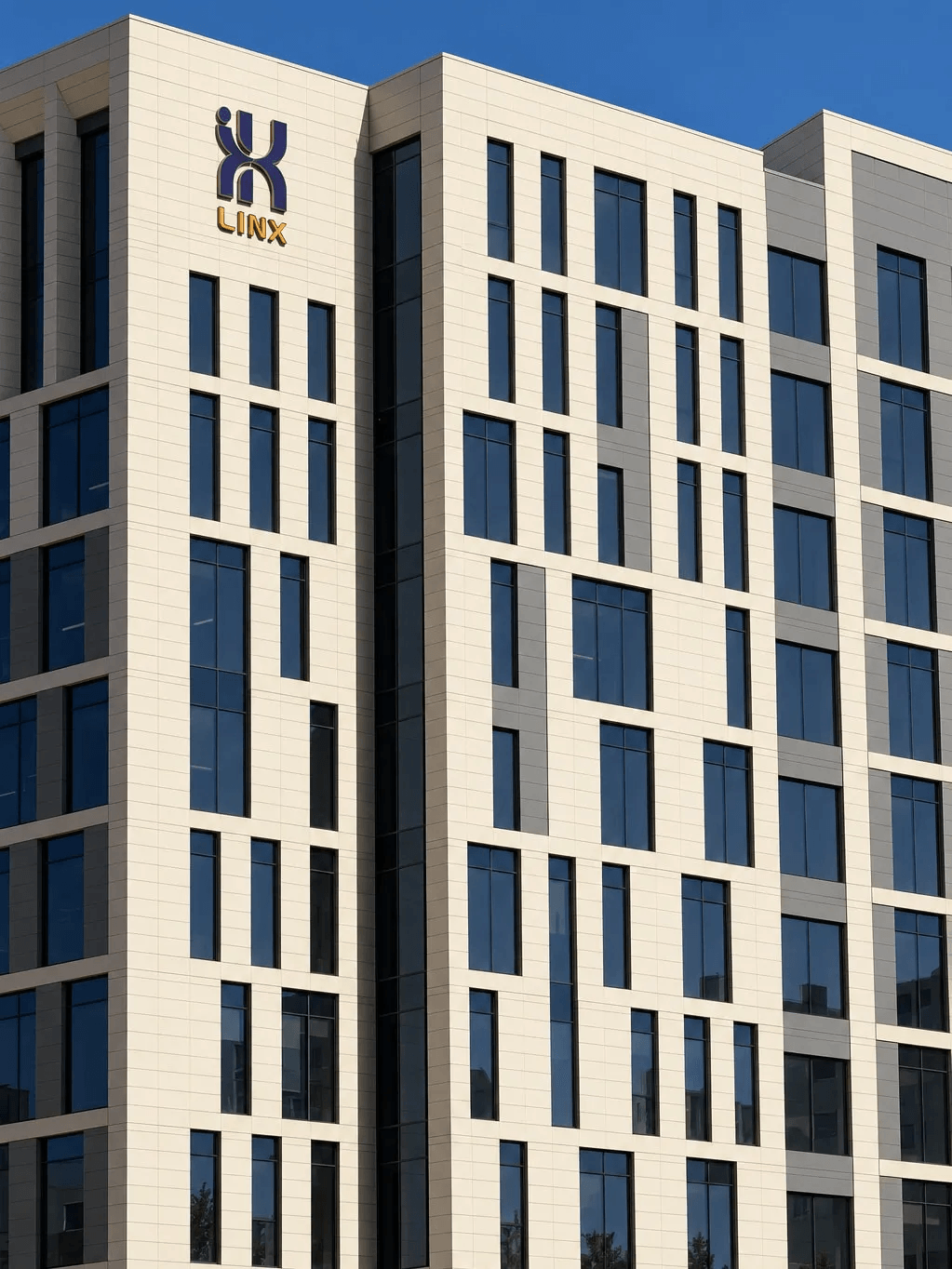 The LINX emblem and lettering on the cream-clad corner façade